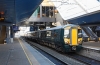 387132