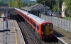 387203
