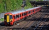 387205